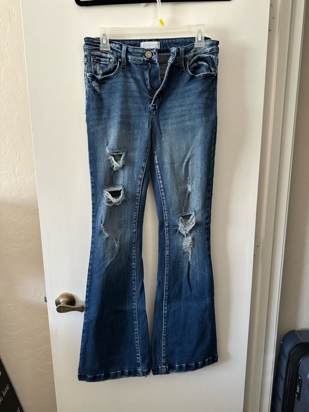 Distressed Flare Jeans in Medium Blue - Women